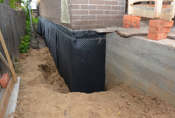 Happy homeowners after waterproofing job in Keyport